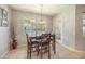 Cozy breakfast nook with a window view to the backyard, complemented by modern light fixture at 4424 Se 14Th St, Ocala, FL 34471