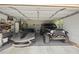 Spacious three car garage showcasing a Corvette and a Jeep Wrangler at 4424 Se 14Th St, Ocala, FL 34471