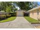 Detached one-car garage with concrete driveway and manicured landscaping at 4424 Se 14Th St, Ocala, FL 34471