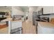 Functional kitchen with white cabinets, stainless steel appliances, and a tile floor at 4424 Se 14Th St, Ocala, FL 34471