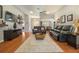 Spacious living room with hardwood floors, a ceiling fan, and an open layout at 4424 Se 14Th St, Ocala, FL 34471