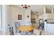 Cozy dining area with chandelier, open to kitchen and living area at 4716 Nw 34Th Pl, Ocala, FL 34482