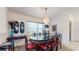 Elegant dining room featuring chandelier, unique decor, and ample natural light at 4716 Nw 34Th Pl, Ocala, FL 34482