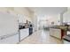 Bright kitchen with white cabinetry, contrasting countertops, stainless appliances, and tile flooring at 4716 Nw 34Th Pl, Ocala, FL 34482