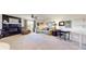 Spacious living room with fireplace, neutral carpeting, ample seating, and ceiling fan at 4716 Nw 34Th Pl, Ocala, FL 34482