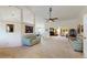 Expansive living room with ceiling fan offering seamless flow between living and dining areas at 4716 Nw 34Th Pl, Ocala, FL 34482