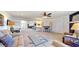 Open-concept living area with comfortable seating, ceiling fan, and seamless flow to dining space at 4716 Nw 34Th Pl, Ocala, FL 34482