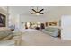 Open living space with high ceilings and fan, connecting seamlessly to dining and other living areas at 4716 Nw 34Th Pl, Ocala, FL 34482