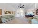 Large living room featuring high ceilings, ceiling fan, and views into the dining area at 4716 Nw 34Th Pl, Ocala, FL 34482