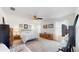 Spacious main bedroom with ceiling fan, carpet flooring, and natural lighting at 4716 Nw 34Th Pl, Ocala, FL 34482