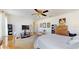 Spacious main bedroom with ceiling fan, carpet flooring, and natural lighting at 4716 Nw 34Th Pl, Ocala, FL 34482