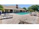 Community pool area featuring ample seating and lounge chairs for residents to enjoy poolside relaxation at 4716 Nw 34Th Pl, Ocala, FL 34482