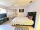 Bedroom with tile flooring, ceiling fan, closet, and large window for plenty of natural light at 5606 Sw 107Th St, Ocala, FL 34476