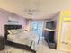 Serene primary bedroom with sliding door access to the patio, offering plenty of natural light at 5606 Sw 107Th St, Ocala, FL 34476