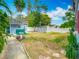 Landscaped backyard with lush greenery, shed, and potential for outdoor enjoyment at 6403 Summit Dr, Orlando, FL 32810