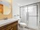 Updated bathroom with new vanity, toilet, and shower with glass doors at 6403 Summit Dr, Orlando, FL 32810