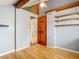 This bedroom features light-gray walls, wood floors, and open storage at 6403 Summit Dr, Orlando, FL 32810