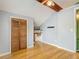 Bedroom with wood floor, closet and built-in desk area at 6403 Summit Dr, Orlando, FL 32810