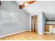 A well-lit bedroom features light wood flooring, closet, and desk at 6403 Summit Dr, Orlando, FL 32810