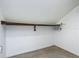 Simple closet with one shelf for storage and hanging clothes at 6403 Summit Dr, Orlando, FL 32810