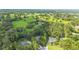 Breathtaking aerial view showing the property's placement amidst lush, green surroundings and neighboring homes at 733 Se 67Th Ln, Ocala, FL 34480