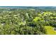 Beautiful aerial view showcasing the area's landscape and highlighting the many homes surrounded by lush foliage and greenery at 733 Se 67Th Ln, Ocala, FL 34480