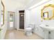 Bright bathroom with a glass shower, a pedestal sink, and a toilet; natural light accents at 733 Se 67Th Ln, Ocala, FL 34480