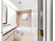 Cozy bathroom with shower-tub, neutral tiling, a double sink, and a vanity mirror at 733 Se 67Th Ln, Ocala, FL 34480