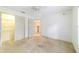 Bedroom featuring neutral carpeting, ample natural light, and access to a walk-in closet at 733 Se 67Th Ln, Ocala, FL 34480