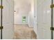 Bedroom entrance showcasing vaulted ceilings and a window with natural light at 733 Se 67Th Ln, Ocala, FL 34480
