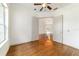 Bedroom with French doors, wood floors, a ceiling fan, and ample natural light at 733 Se 67Th Ln, Ocala, FL 34480