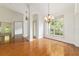 Inviting dining space featuring hardwood floors, chandelier, and natural light at 733 Se 67Th Ln, Ocala, FL 34480