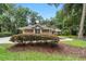 Inviting single-story home with manicured lawn and inviting walkway, surrounded by mature trees and lush landscaping at 733 Se 67Th Ln, Ocala, FL 34480