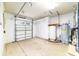 Utility area in the garage featuring a water heater and additional storage space at 733 Se 67Th Ln, Ocala, FL 34480