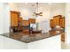 Beautiful kitchen with custom cabinets, granite countertops, and stainless steel appliances, perfect for cooking at 733 Se 67Th Ln, Ocala, FL 34480