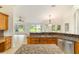 Bright kitchen offers stainless steel appliances, granite countertops, and an adjacent dining area at 733 Se 67Th Ln, Ocala, FL 34480