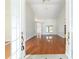 Inviting living room with hardwood floors, white walls, high ceilings, and an abundance of natural light at 733 Se 67Th Ln, Ocala, FL 34480