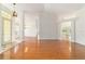Spacious living area featuring hardwood floors, elegant lighting, and natural light at 733 Se 67Th Ln, Ocala, FL 34480