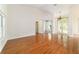 Large living space featuring hardwood floors, high ceilings, and natural light at 733 Se 67Th Ln, Ocala, FL 34480