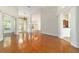 Open-concept living area with hardwood floors, natural light, and views to other rooms at 733 Se 67Th Ln, Ocala, FL 34480
