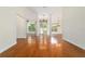 Bright open living space with hardwood floors, high ceilings, and elegant chandeliers at 733 Se 67Th Ln, Ocala, FL 34480