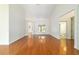 Bright living room with hardwood floors, white walls, high ceilings, and an abundance of natural light at 733 Se 67Th Ln, Ocala, FL 34480