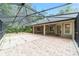Large screened patio with brick pavers offering an ideal space for outdoor entertainment and relaxation at 733 Se 67Th Ln, Ocala, FL 34480