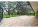 Screened in patio with brick pavers provides an inviting outdoor space overlooking the lush yard at 733 Se 67Th Ln, Ocala, FL 34480