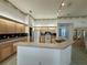 Well-lit kitchen with ample counter space, light wood cabinetry, and a breakfast bar at 7421 Sw 110Th Pl, Ocala, FL 34476