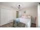 Bedroom with a full closet and a comfortable bed with a ceiling fan at 77 Locust Dr, Ocala, FL 34472