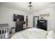 Bright bedroom with a TV, ceiling fan and large closet at 77 Locust Dr, Ocala, FL 34472