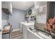 Functional laundry room with shelving and modern appliances at 77 Locust Dr, Ocala, FL 34472