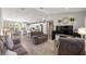 Open-concept layout seamlessly connects the living area to a modern kitchen with an island and dining space at 77 Locust Dr, Ocala, FL 34472