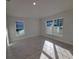 Bright bedroom with large windows and tile floors, offering ample natural light at 8344 Sw 57Th Ct, Ocala, FL 34476